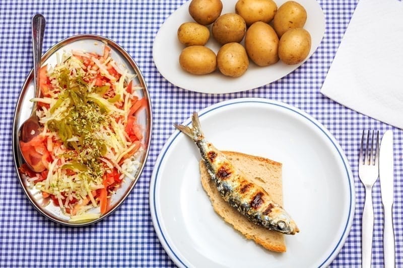 Grilled sardines with salad, bread and potato, Portugal.